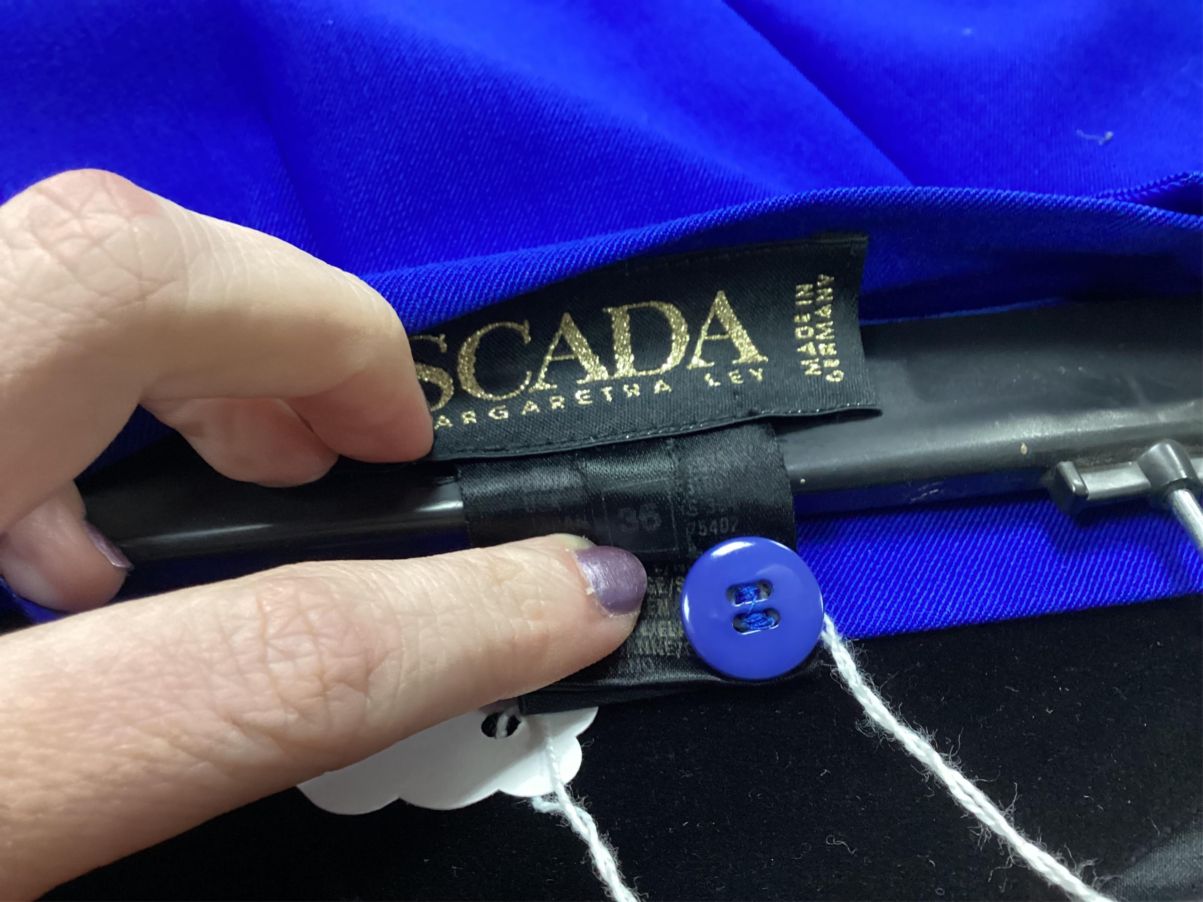 Two Escada skirts and a multi colour silk body blouse. Proceeds to Happy Paws Puppy Rescue